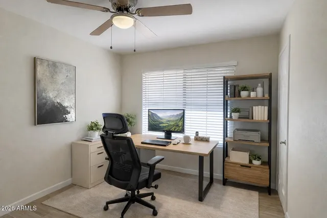 a work room with furniture and a window