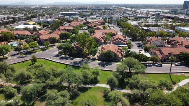 an aerial view of residential houses with outdoor space