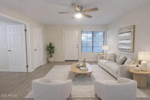 a living room with furniture and window