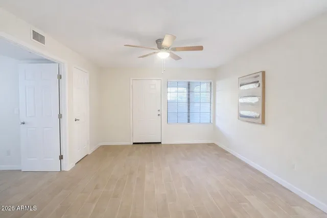 a view of an empty room with a window