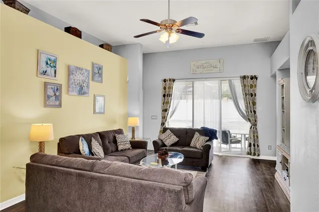 a living room with furniture and a window
