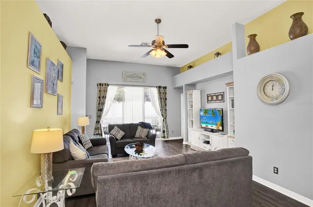 a living room with furniture and a window
