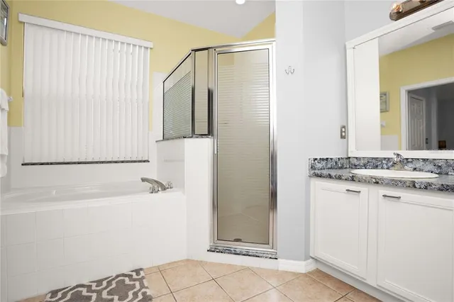 a bathroom with a bathtub and a sink