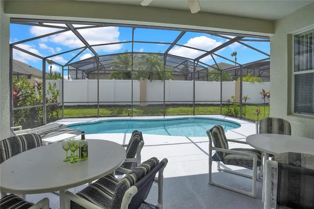 a view of a chairs and table in the patio
