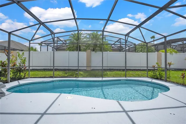 a view of a backyard with a small swimming pool