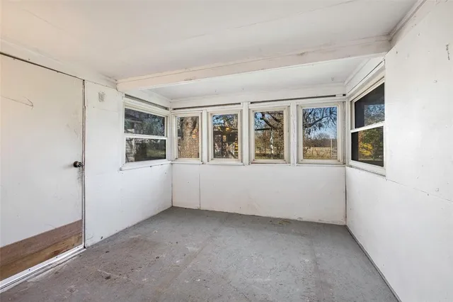 a view of empty room with windows