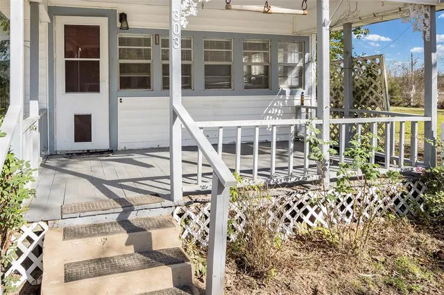 front view of a house with a large window