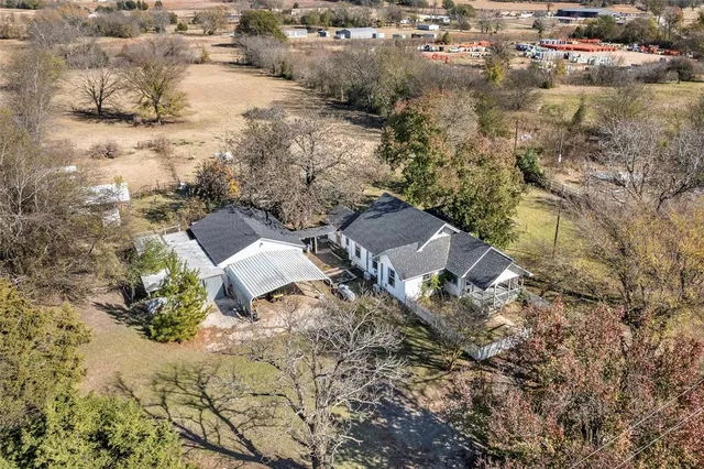 an aerial view of residential house with parking space