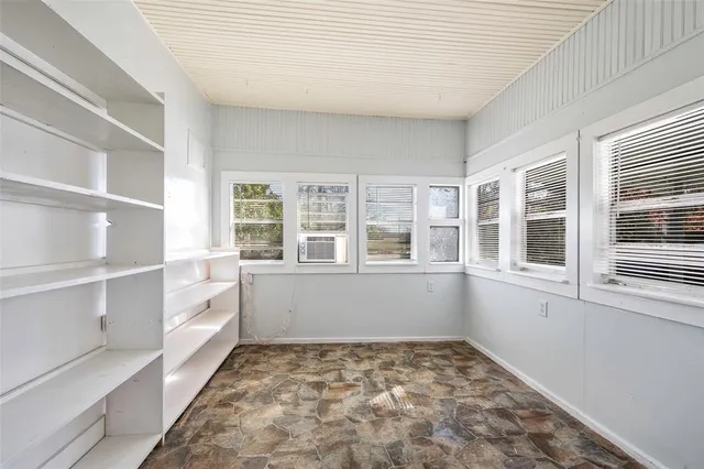 a view of empty room with windows