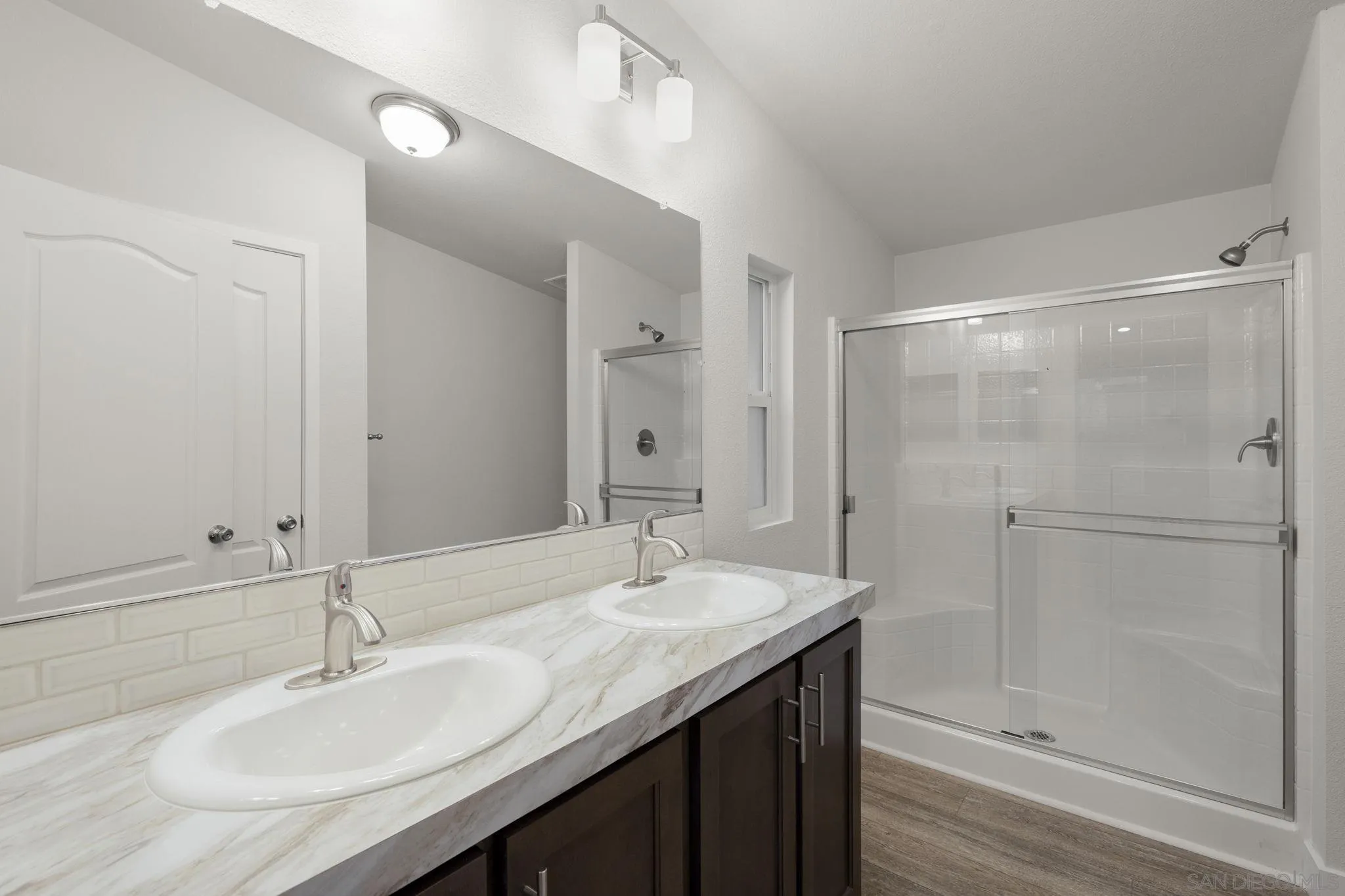 22899 Byron Road, Unit SPC 108 Crestline, CA 92325 - Photo 11 of 27 a bathroom with a granite countertop sink and a mirror