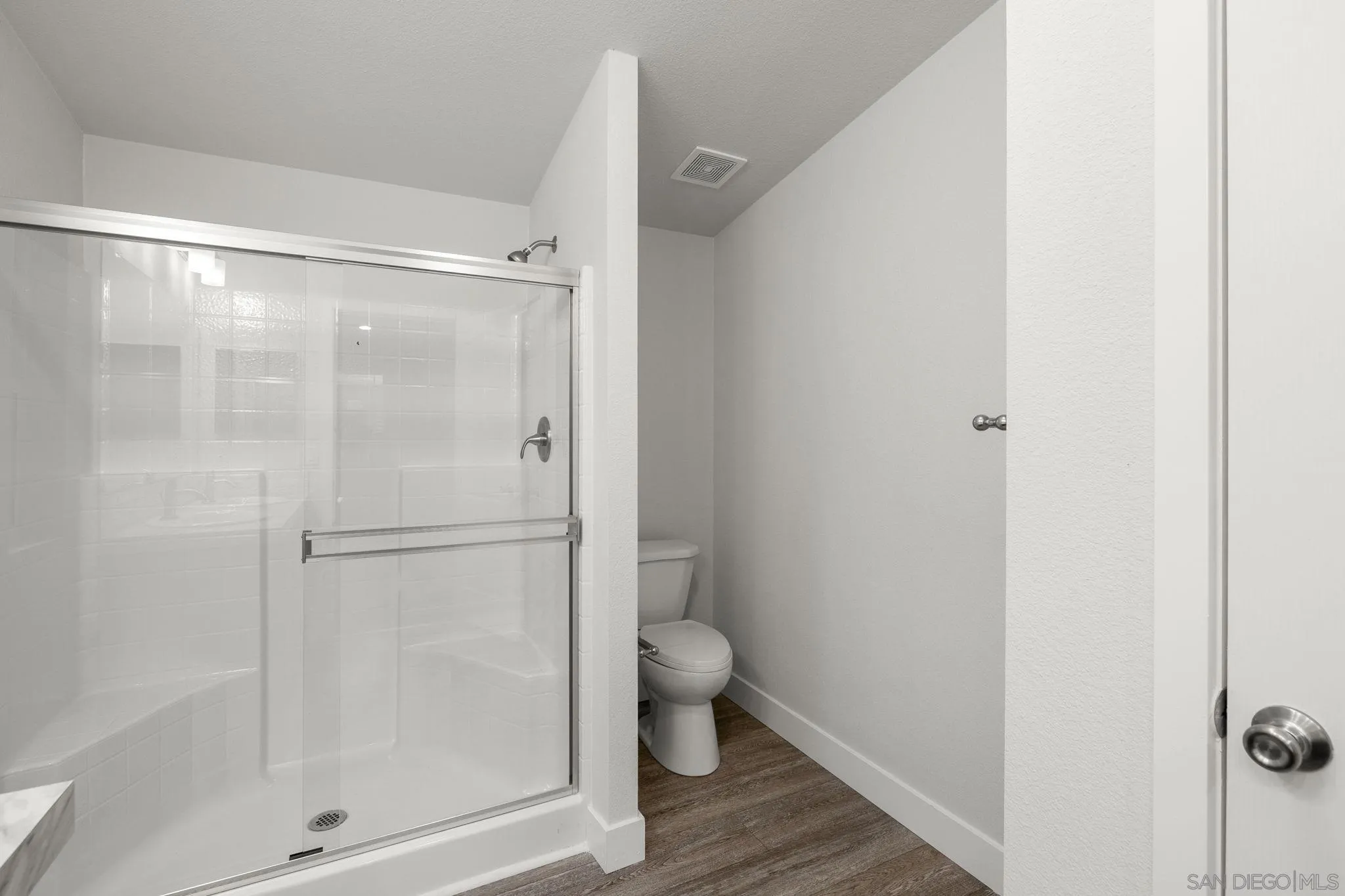 22899 Byron Road, Unit SPC 108 Crestline, CA 92325 - Photo 14 of 27 a bathroom with a glass shower door