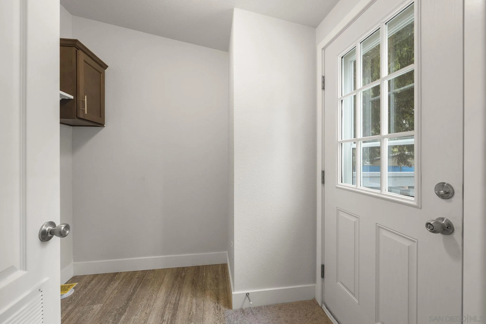 22899 Byron Road, Unit SPC 108 Crestline, CA 92325 - Photo 15 of 27 a view of an empty room with wooden floor and a window