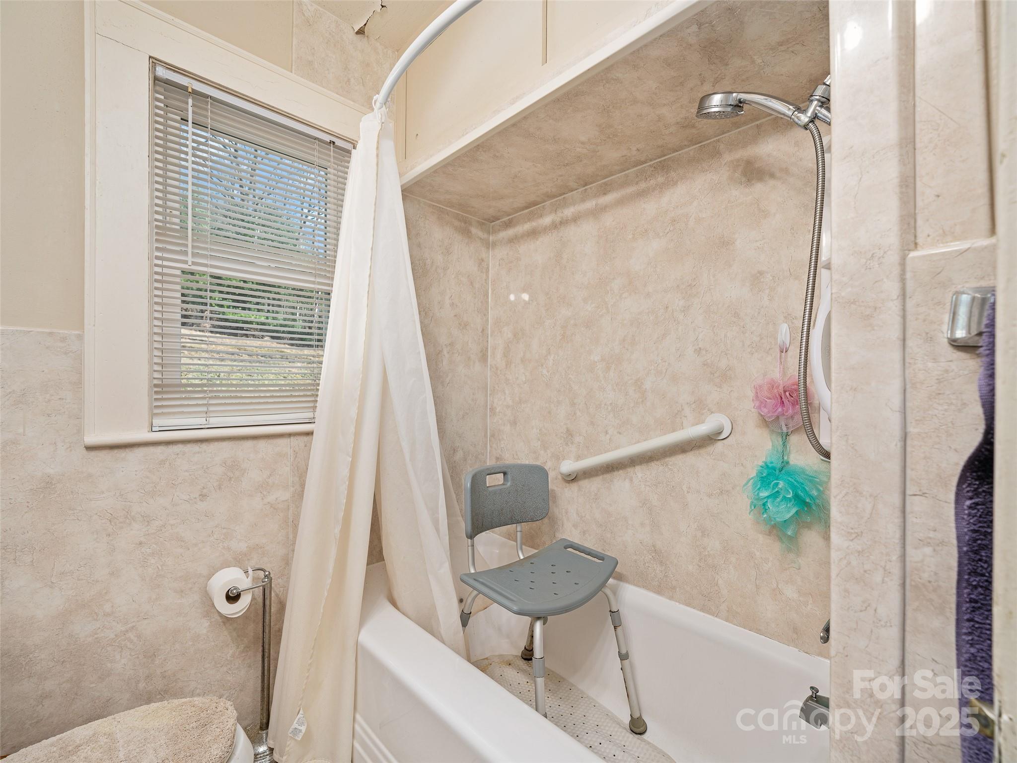 35 Smith Rdg Drive Asheville, NC 28803 - Photo 14 of 38 a bathroom with a sink and a mirror