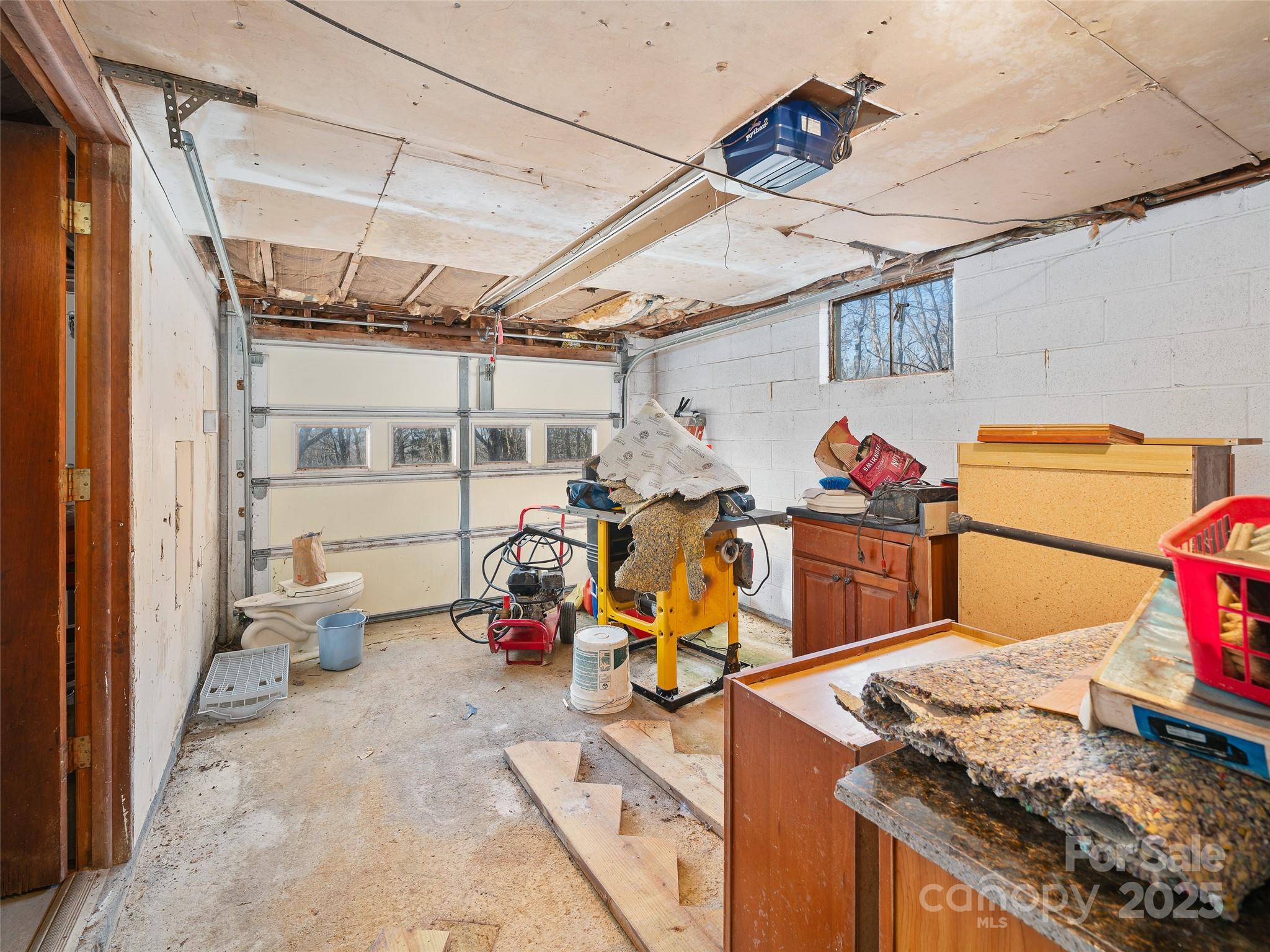 35 Smith Rdg Drive Asheville, NC 28803 - Photo 23 of 38 a storage room with storage and utility