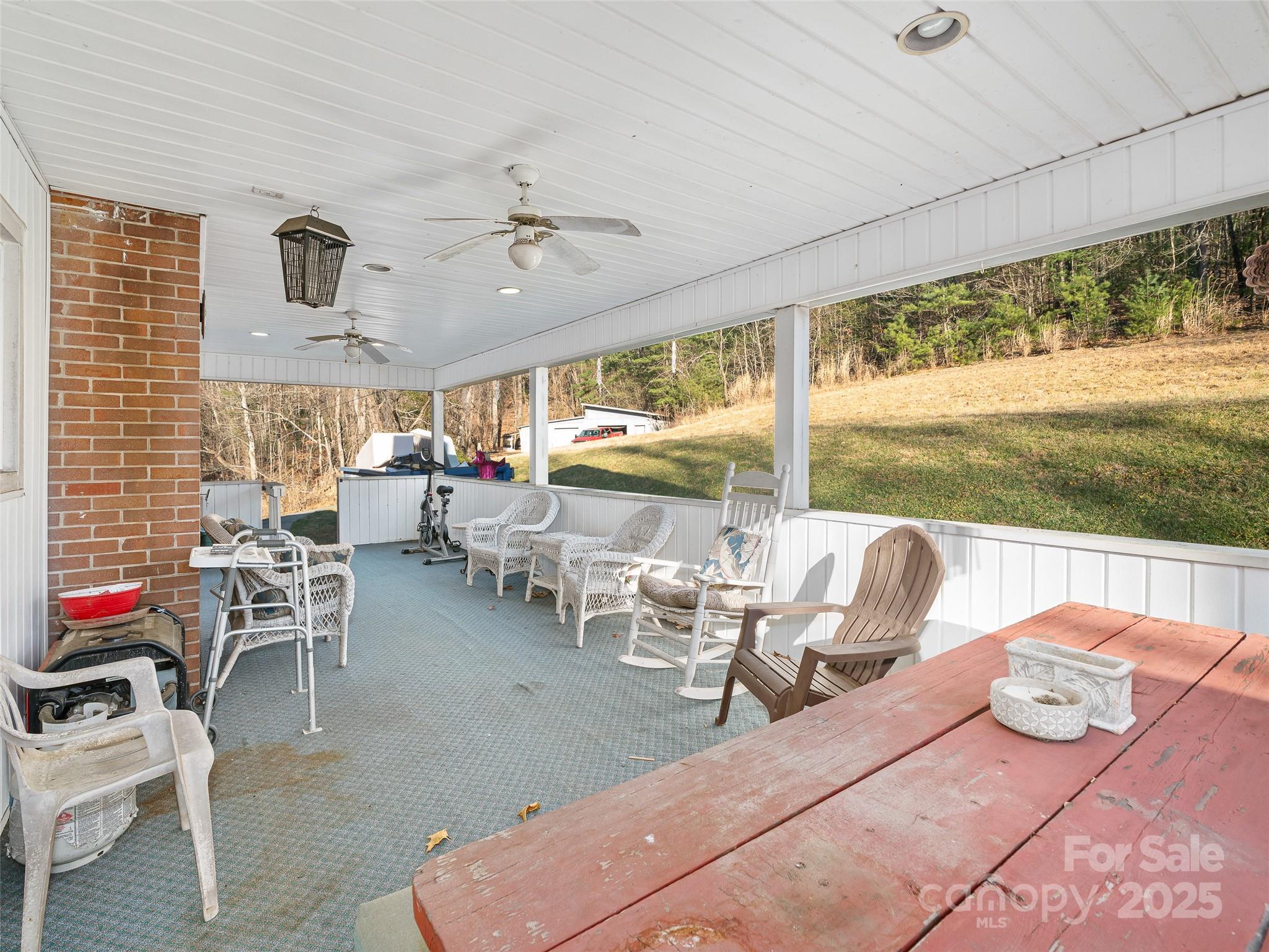 35 Smith Rdg Drive Asheville, NC 28803 - Photo 27 of 38 a living room with furniture and a floor to ceiling window