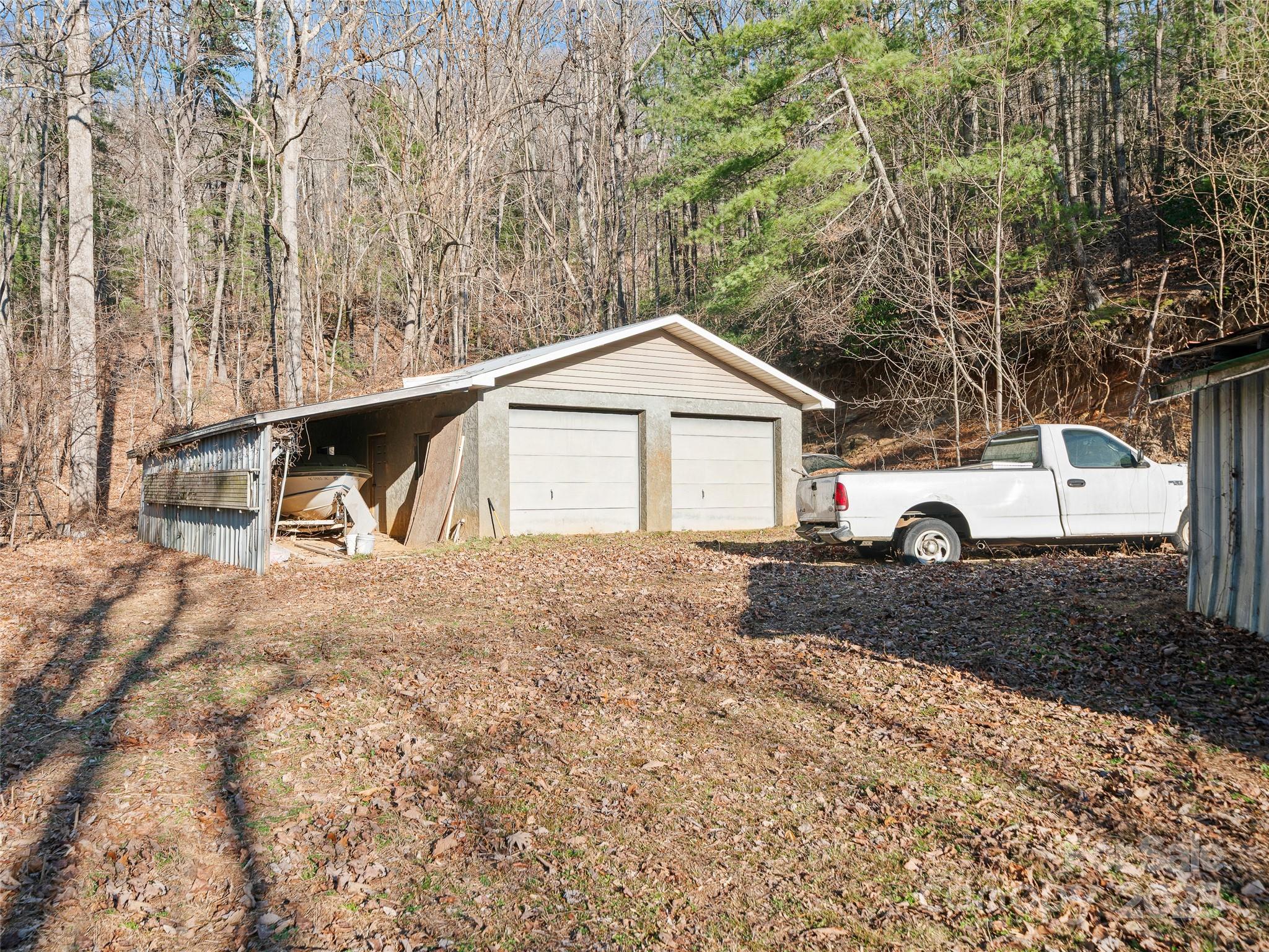 35 Smith Rdg Drive Asheville, NC 28803 - Photo 29 of 38 a front view of a house with a yard and garage
