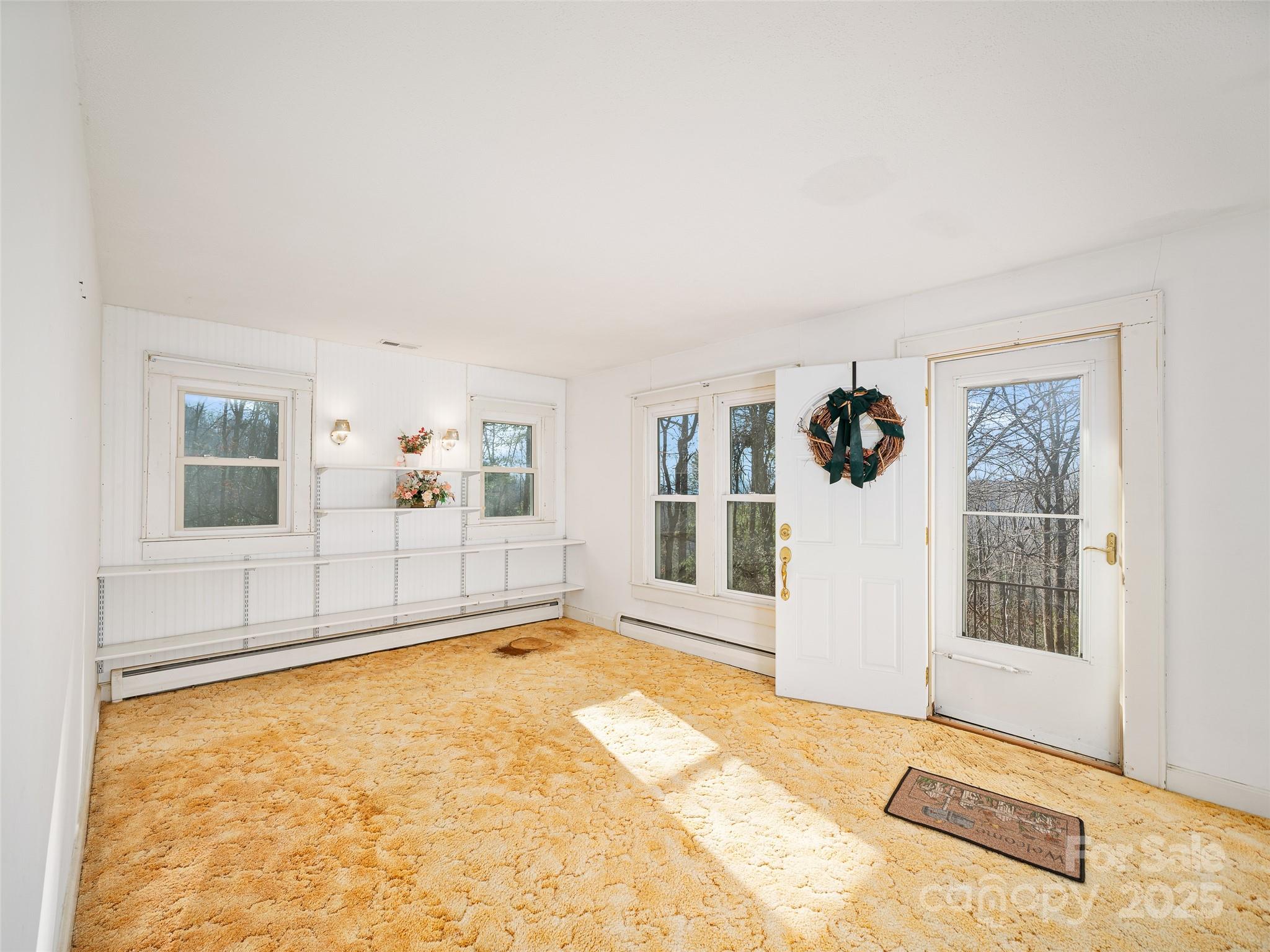 35 Smith Rdg Drive Asheville, NC 28803 - Photo 3 of 38 a view of an empty room with a window