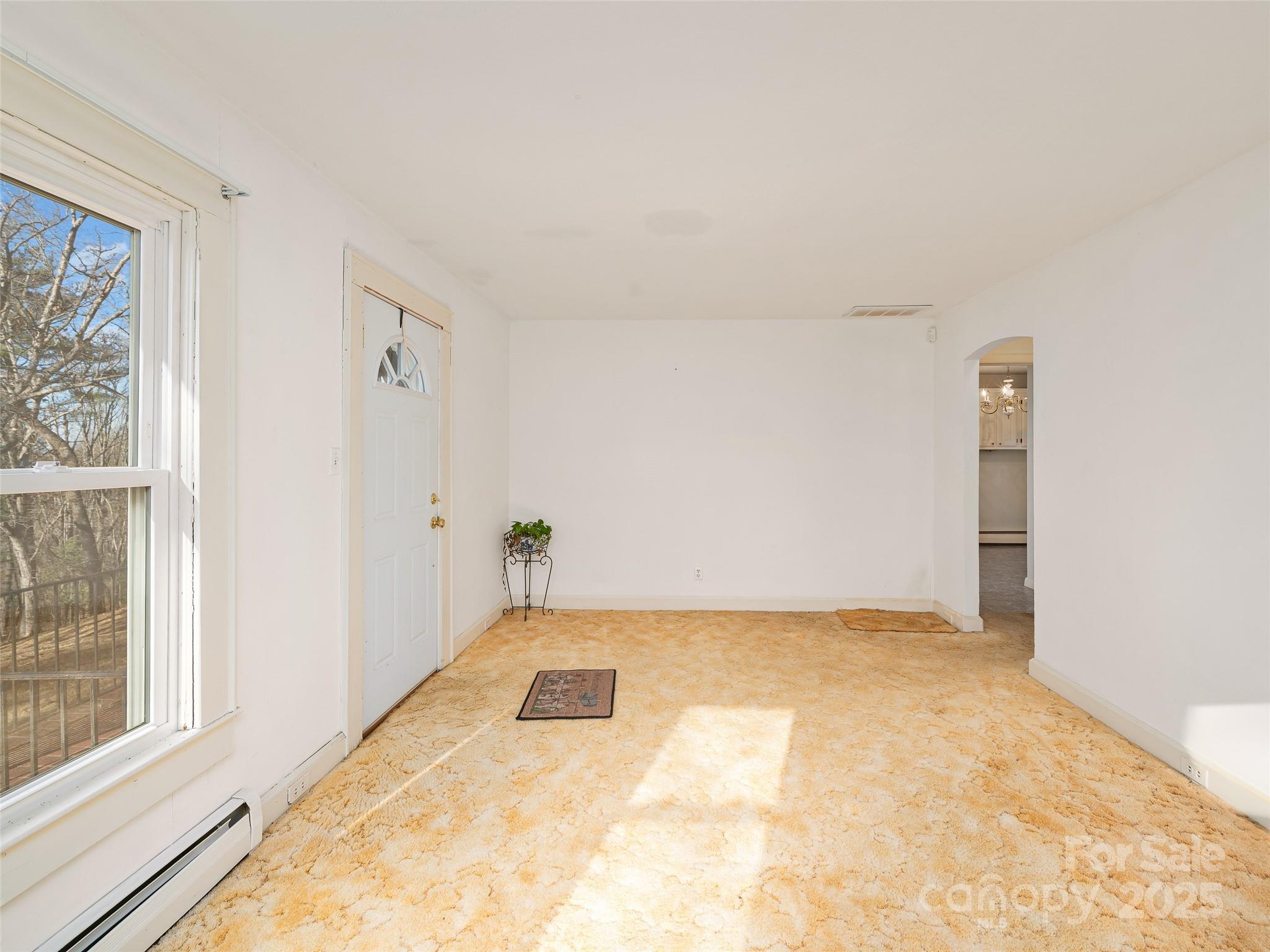 35 Smith Rdg Drive Asheville, NC 28803 - Photo 5 of 38 a view of an empty room with a window