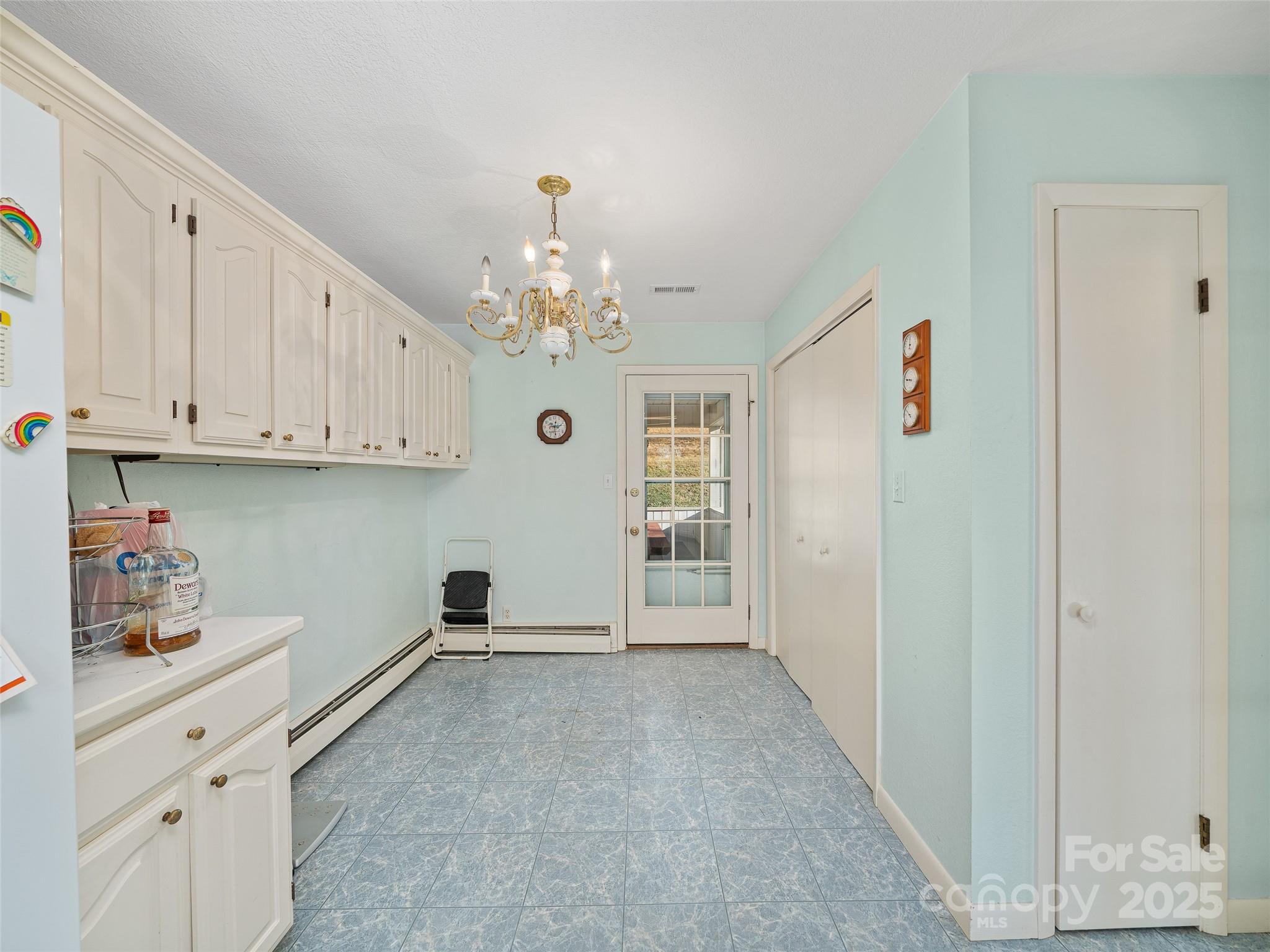 35 Smith Rdg Drive Asheville, NC 28803 - Photo 9 of 38 a view of kitchen with center island and cabinets