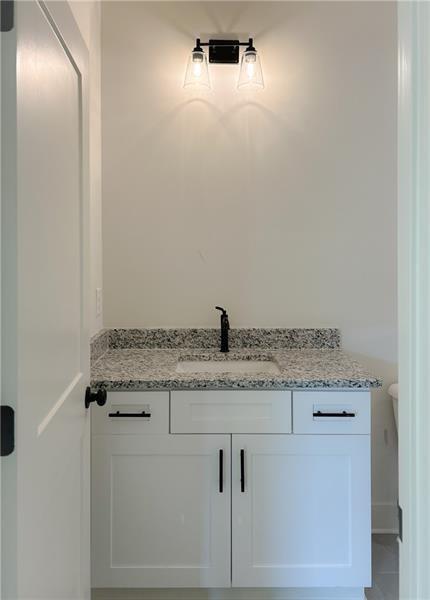 27 Bridgestone Way Cartersville, GA 30120 - Photo 19 of 31 a bathroom with a granite countertop sink and a mirror