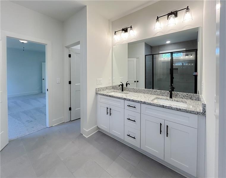 27 Bridgestone Way Cartersville, GA 30120 - Photo 26 of 31 a bathroom with double sink and a mirror