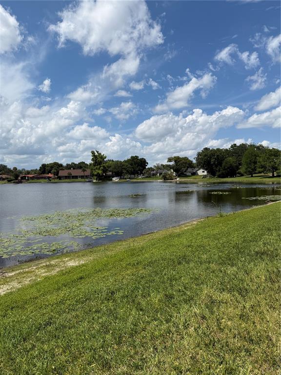 908 Lake Destiny Road, Unit B Altamonte Springs, FL 32714 - Photo 15 of 16 a view of a lake with houses in the back