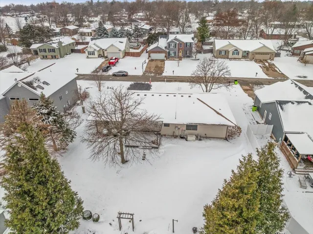 an aerial view of residential houses with outdoor space