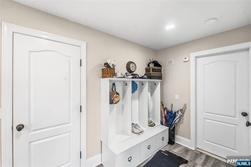 27 Pine Hill Road Old Tappan, NJ 07675 - Photo 16 of 50 a view of walk in closet with clothes and shoes