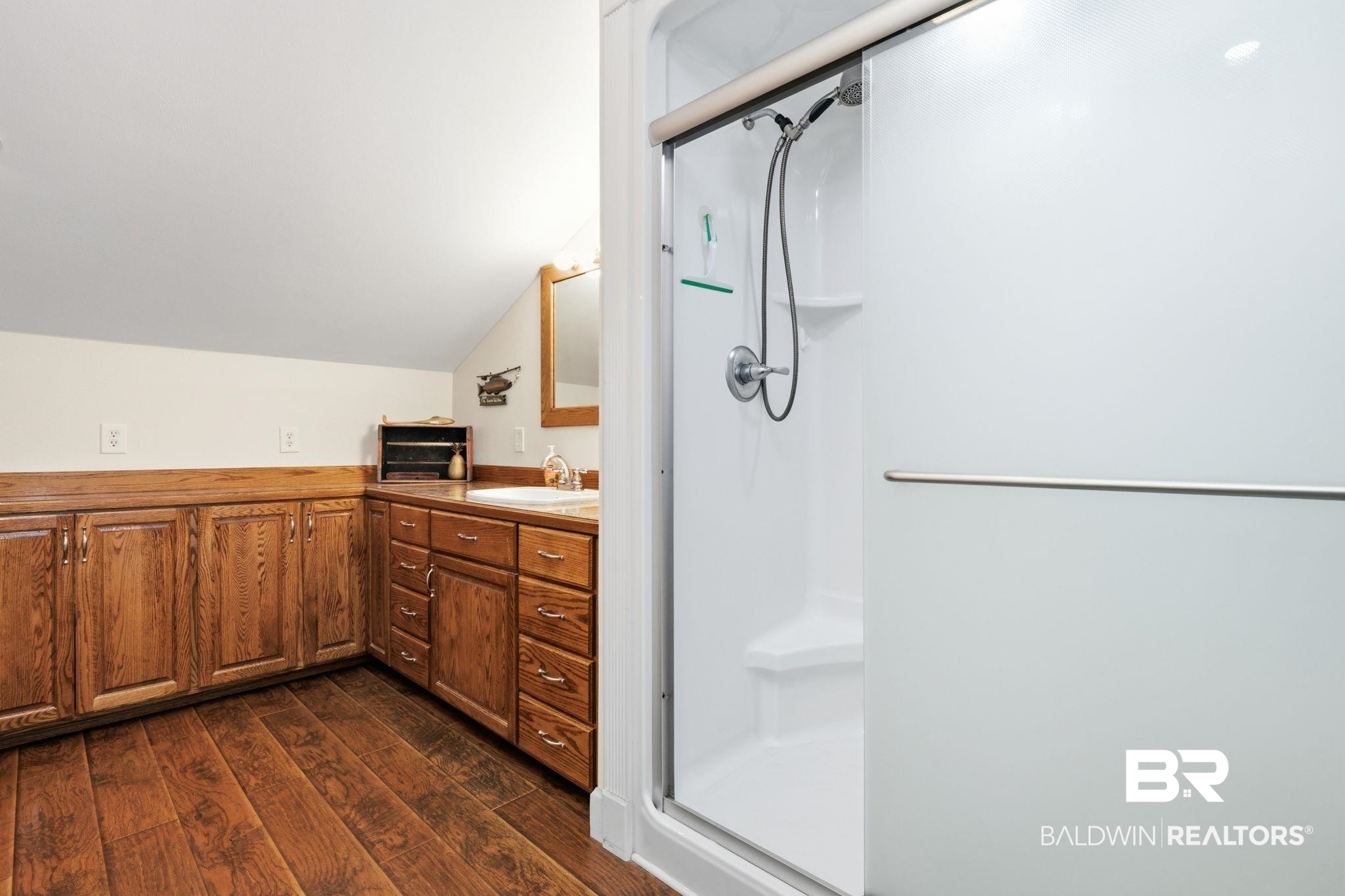 15025 Bellingrath Road Coden, AL 36523 - Photo 63 of 79 Bathroom featuring vanity, a shower stall, dark wood finished floors, and vaulted ceiling