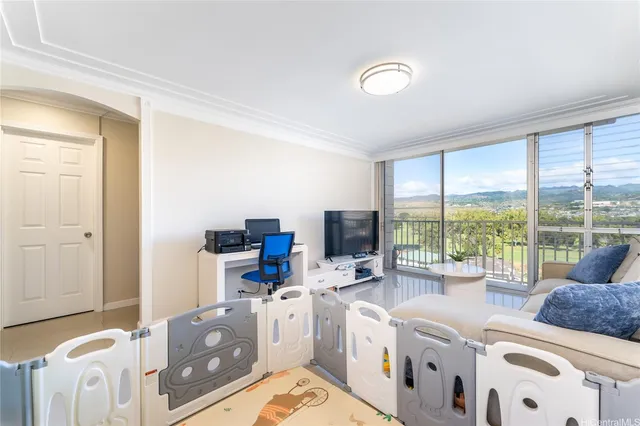 a living room with furniture and a large window