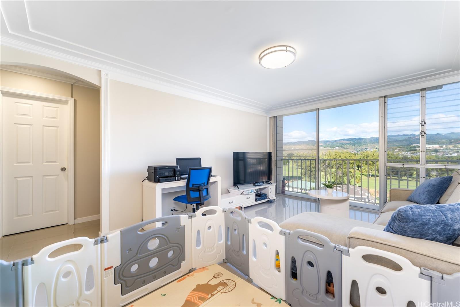 949 Ala Nanala Street, Unit 702 Honolulu, HI 96818 - Photo 15 of 23 a living room with furniture and a large window