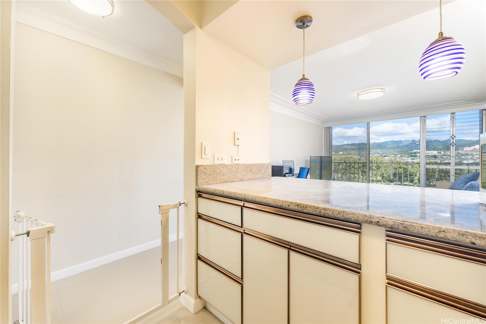949 Ala Nanala Street, Unit 702 Honolulu, HI 96818 - Photo 6 of 23 a view of a kitchen with a sink and a window