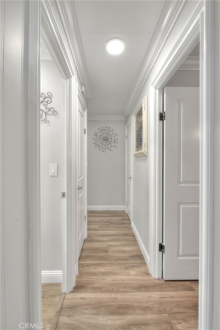1560 Sir Damas, Unit 159 Riverside, CA 92507 - Photo 15 of 25 a view of a hallway with wooden floor and staircase
