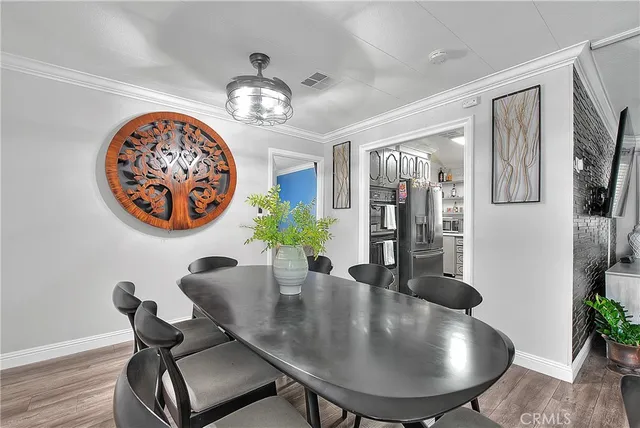 a dining room with furniture and chandelier