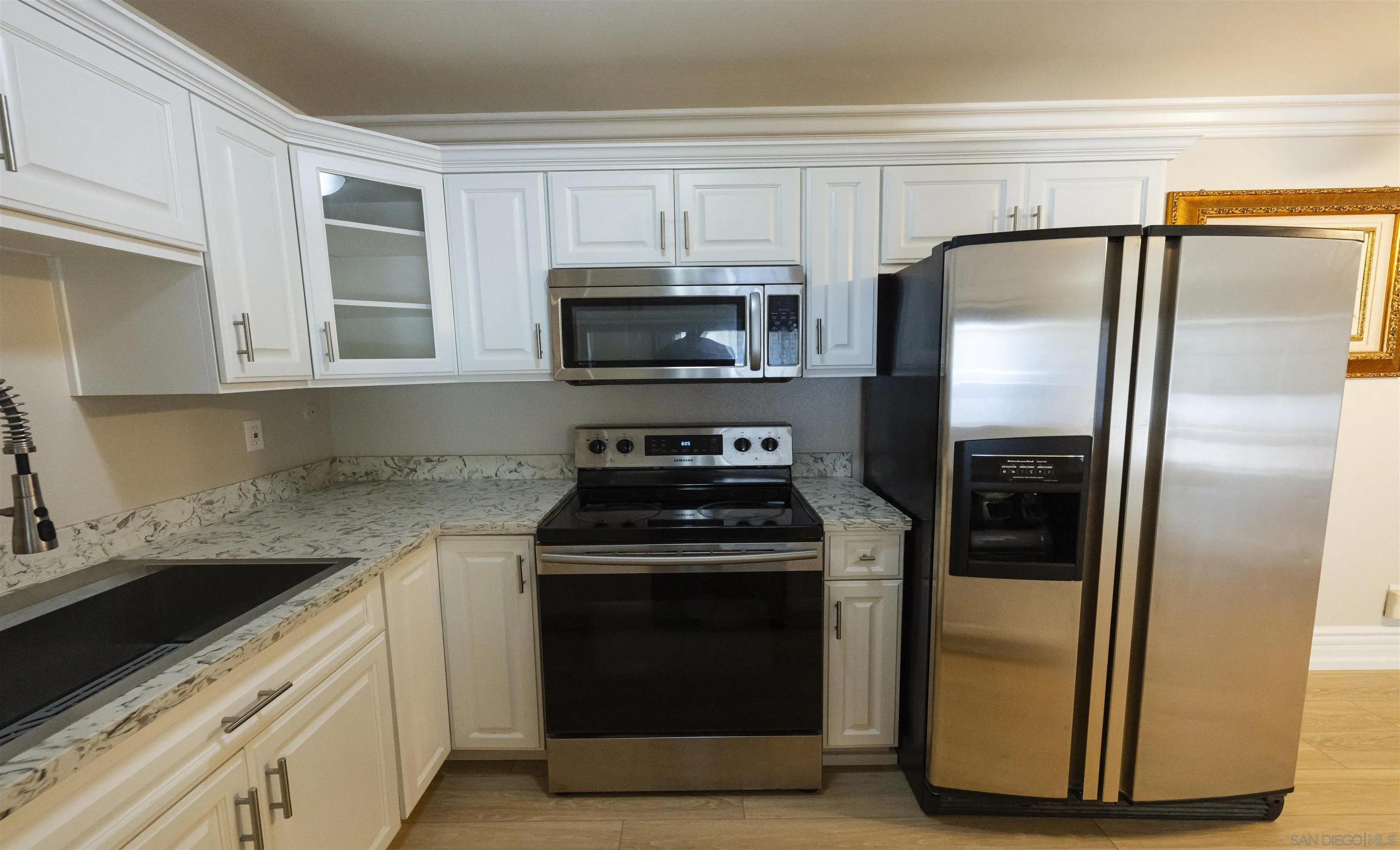 536 Telegraph Canyon Road, Unit E Chula Vista, CA 91910 - Photo 25 of 47 a kitchen with a stove microwave and refrigerator