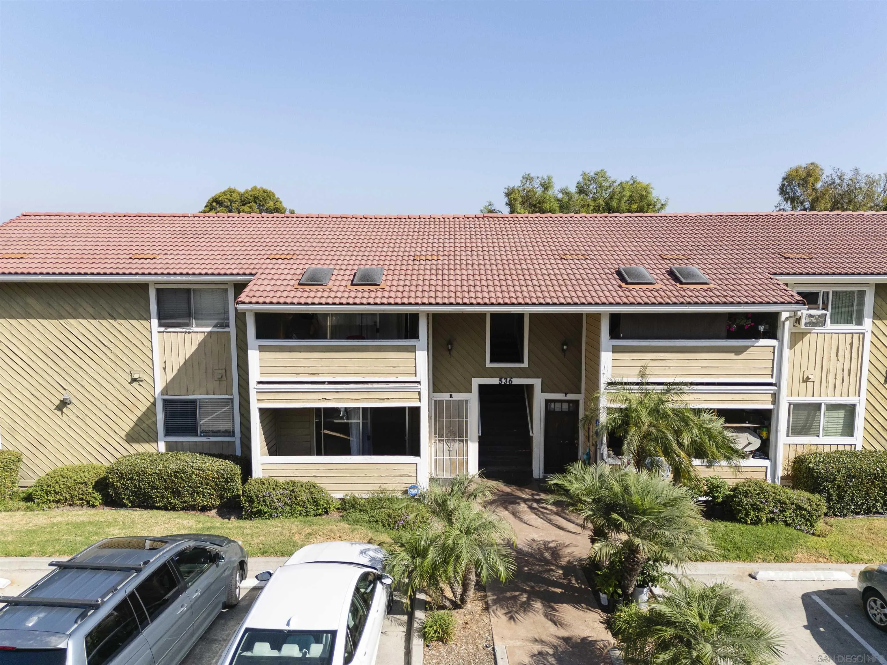 536 Telegraph Canyon Road, Unit E Chula Vista, CA 91910 - Photo 3 of 47 a front view of a house with a yard