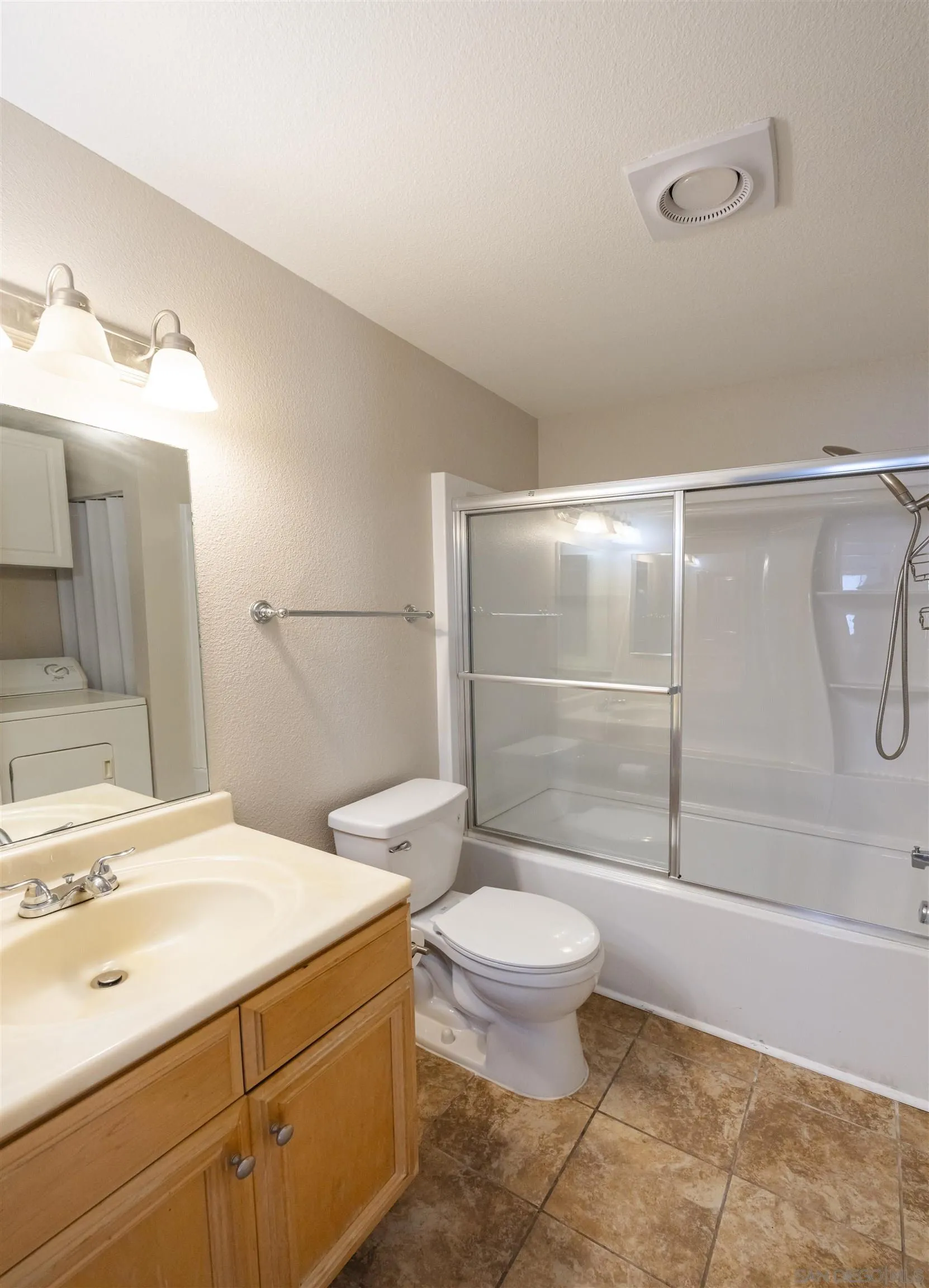 536 Telegraph Canyon Road, Unit E Chula Vista, CA 91910 - Photo 32 of 47 a bathroom with a sink toilet and shower