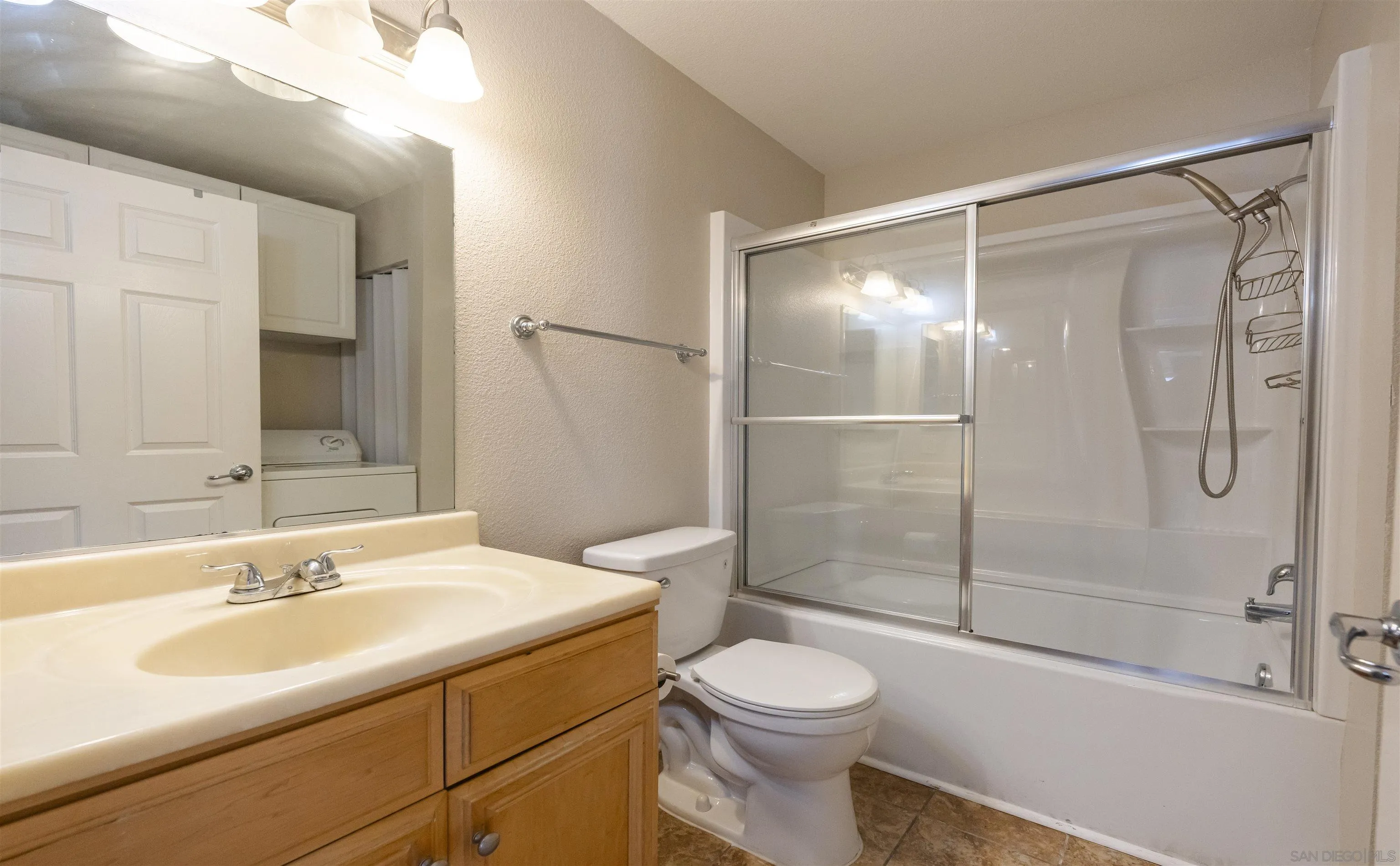 536 Telegraph Canyon Road, Unit E Chula Vista, CA 91910 - Photo 34 of 47 a bathroom with a sink toilet and shower