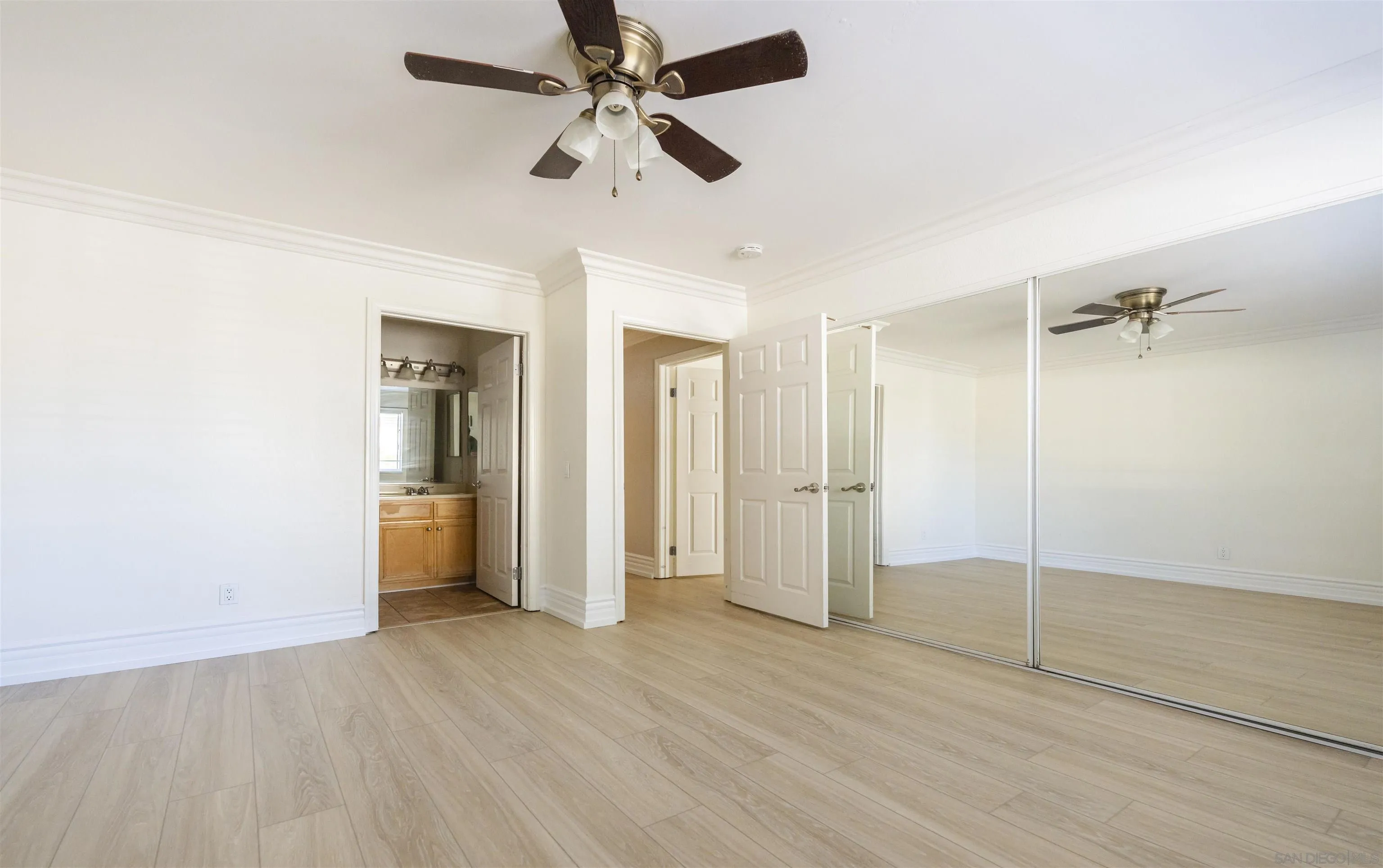 536 Telegraph Canyon Road, Unit E Chula Vista, CA 91910 - Photo 38 of 47 an empty room with closet and a ceiling fan