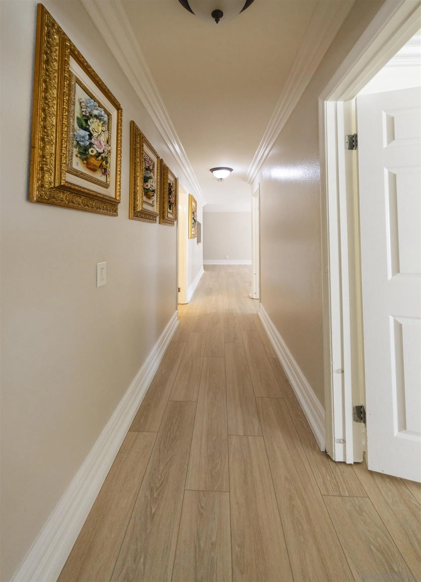 536 Telegraph Canyon Road, Unit E Chula Vista, CA 91910 - Photo 41 of 47 a view of a hallway with wooden floor