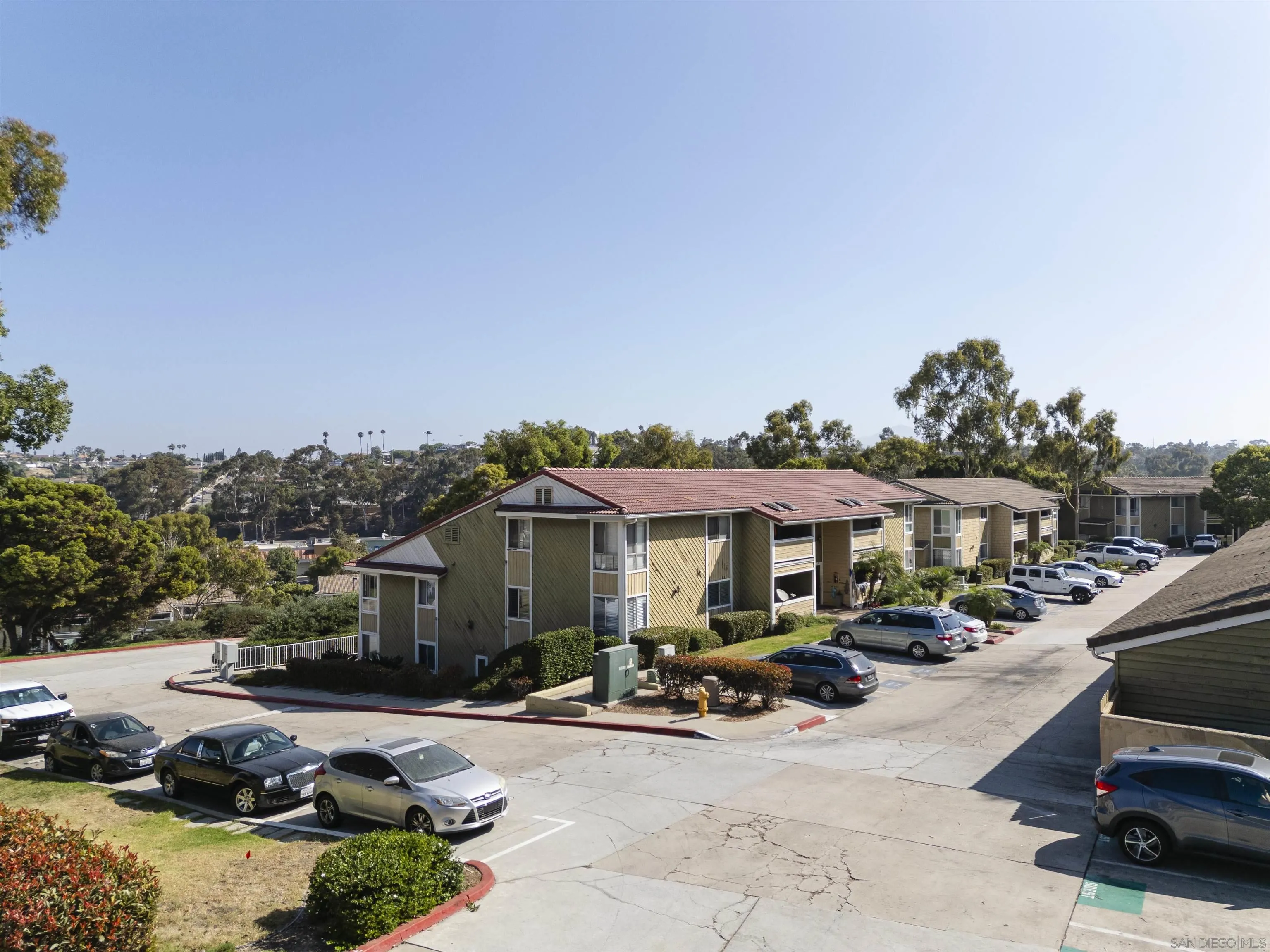 536 Telegraph Canyon Road, Unit E Chula Vista, CA 91910 - Photo 45 of 47 a view of a street with cars park