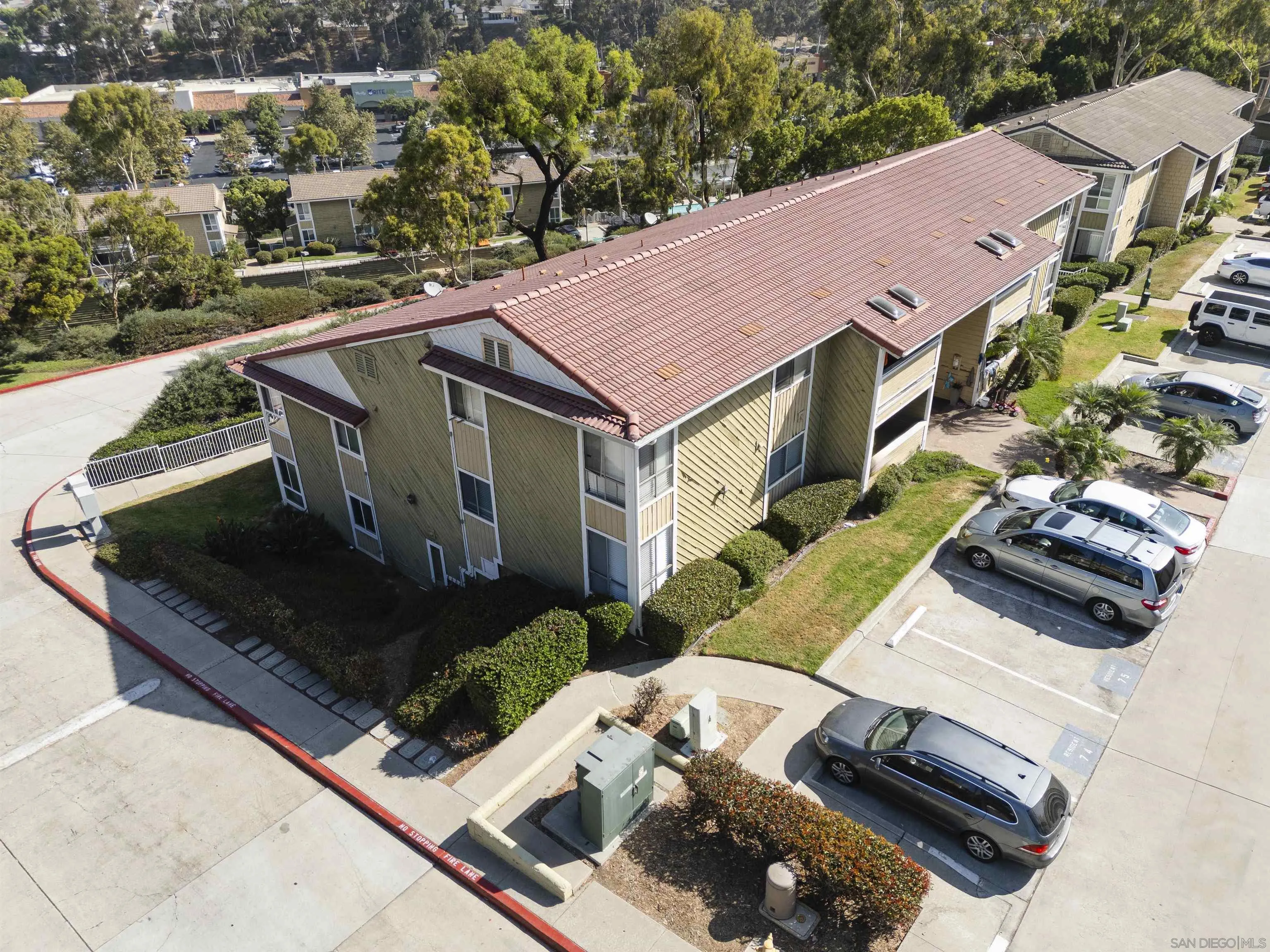 536 Telegraph Canyon Road, Unit E Chula Vista, CA 91910 - Photo 46 of 47 a view of a house with pool and chairs