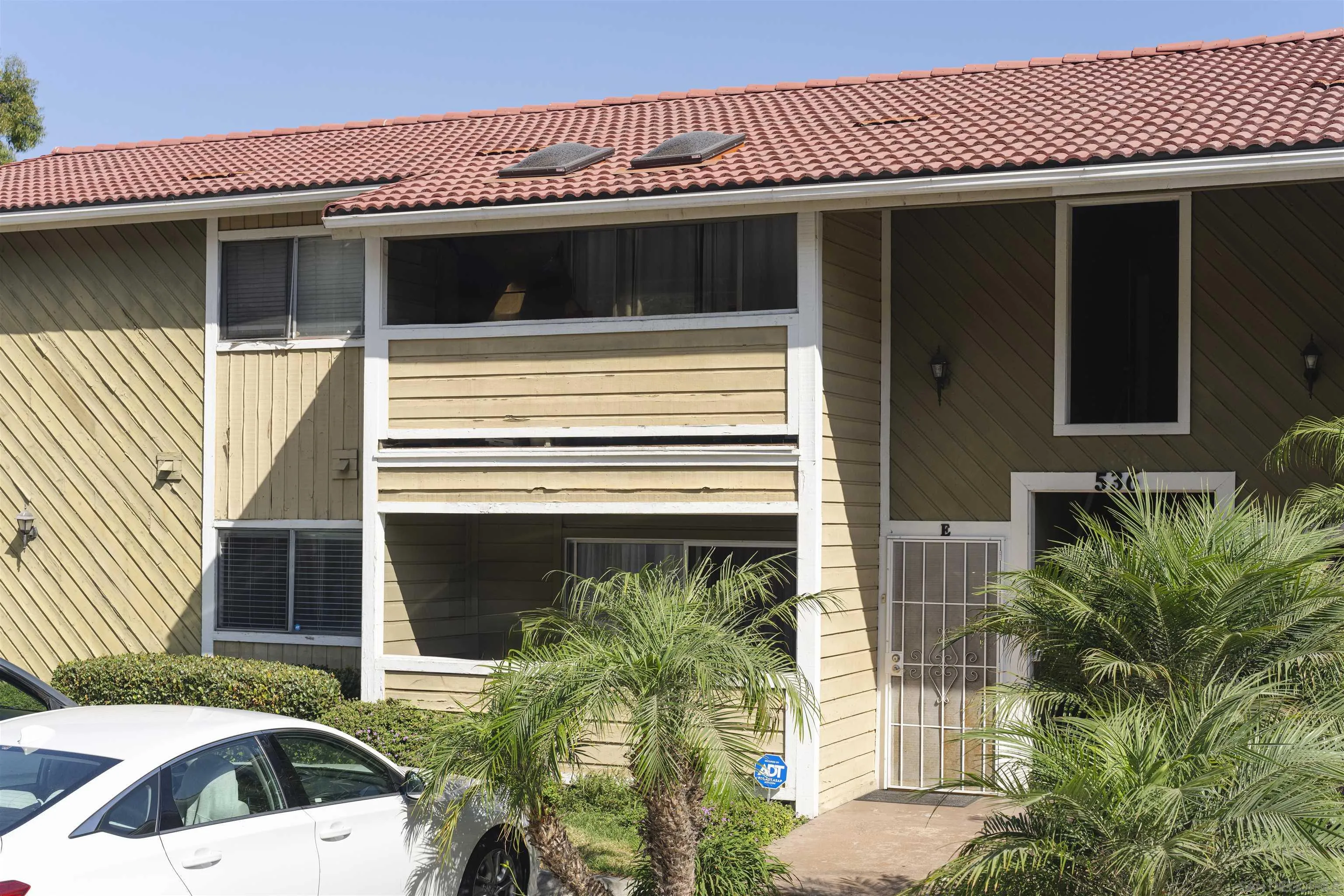 536 Telegraph Canyon Road, Unit E Chula Vista, CA 91910 - Photo 7 of 47 a view of a house with a door and a window