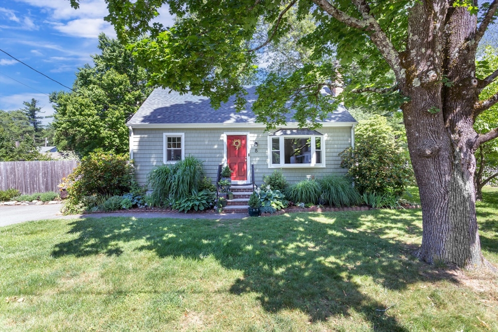 a front view of a house with a yard