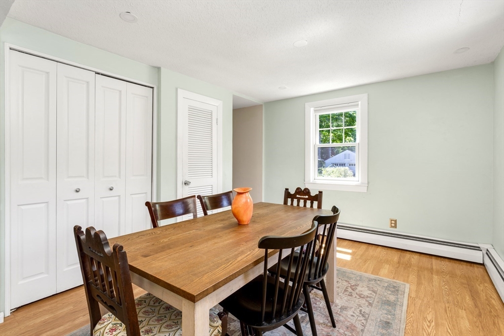 8 May Street Sharon, MA 02067 - Photo 11 of 39 a view of a dining room with furniture and wooden floor
