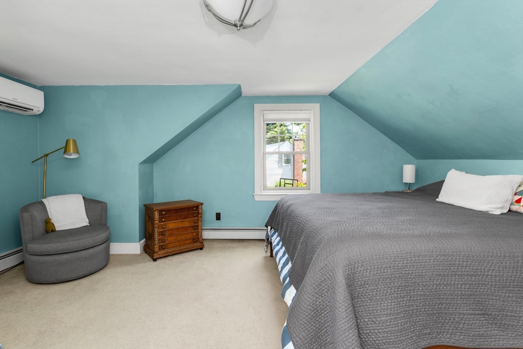 8 May Street Sharon, MA 02067 - Photo 21 of 39 a bedroom with a bed and a couch