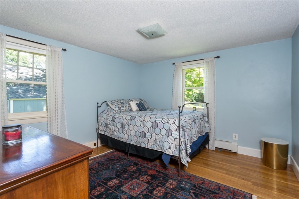 8 May Street Sharon, MA 02067 - Photo 23 of 39 a bedroom with a bed and window