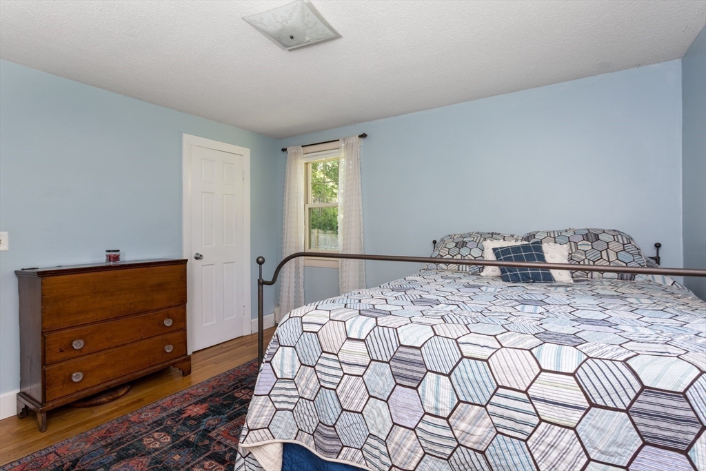 8 May Street Sharon, MA 02067 - Photo 24 of 39 a bedroom with a bed and a dresser