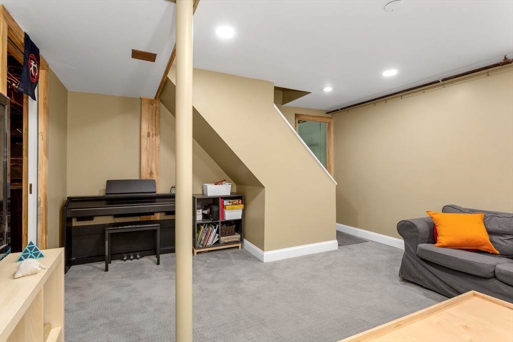 8 May Street Sharon, MA 02067 - Photo 27 of 39 a view of hallway with furniture and stairs