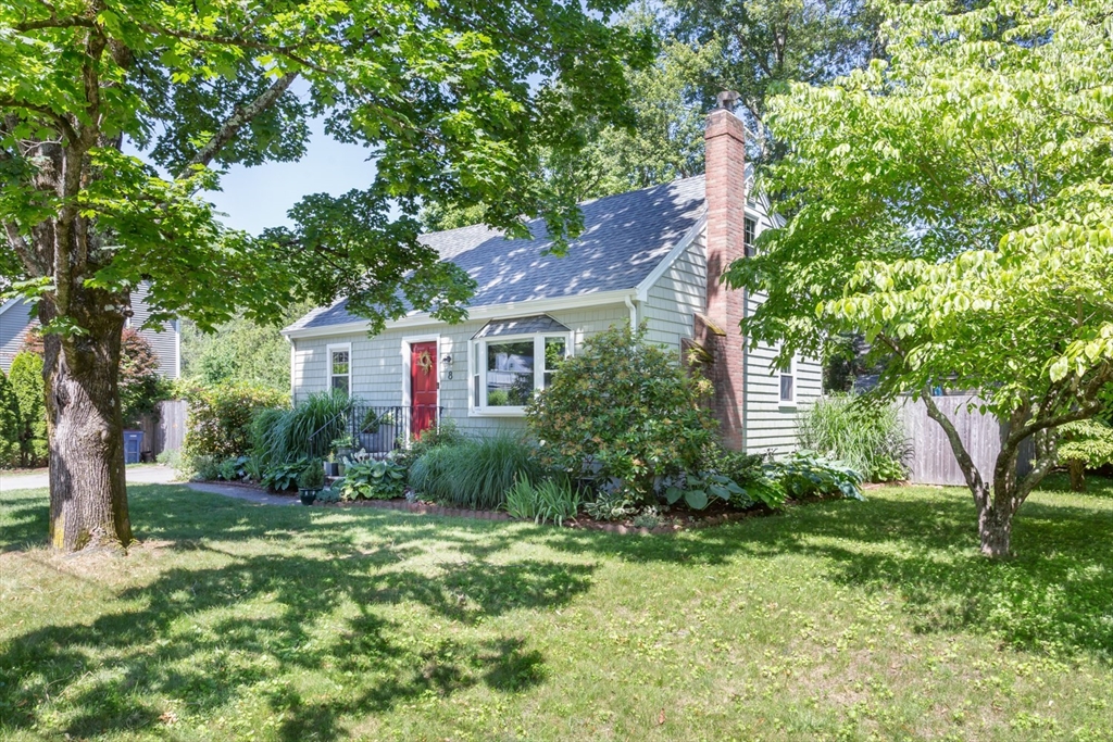8 May Street Sharon, MA 02067 - Photo 3 of 39 a front view of a house with garden